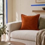 Rust Velvet-Look Cushion Cover — shown in use